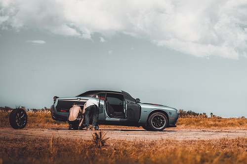 j.a. bombardier boulevard men repairing gray coupe palm bay